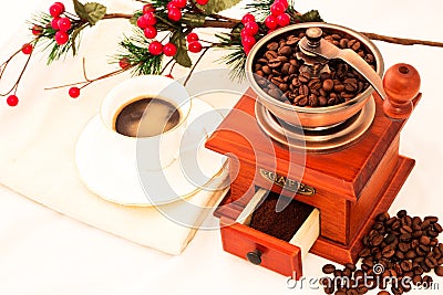 Retro coffee mill and cup of coffee on white background Stock Photo