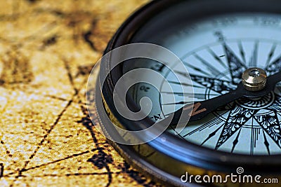 Retro compass on antique world map Stock Photo