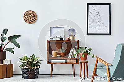 Retro composition of living room interior with mock up poster map, wooden shelf, book, armchair, plant, cacti, vinyl recorder. Stock Photo