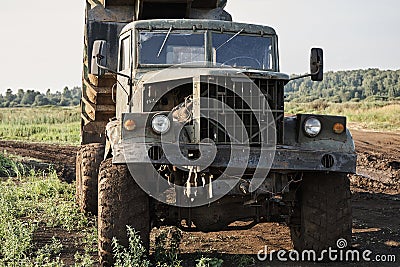 Retro dump truck on a quarry with a raised body Stock Photo