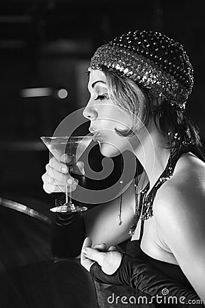 Retro female sitting at bar. Stock Photo