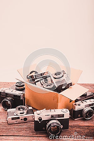 Retro film cameras on wooden background Editorial Stock Photo