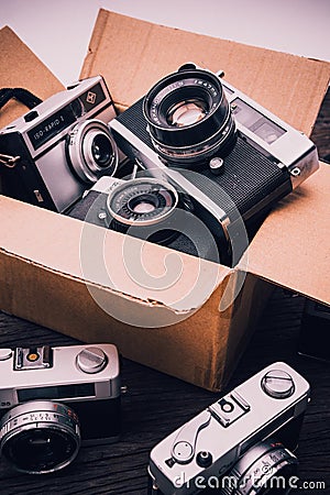 Retro film cameras on wooden background Editorial Stock Photo