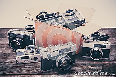 Retro film cameras on wooden background Editorial Stock Photo