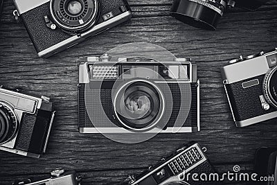 Retro film cameras on wooden background Editorial Stock Photo