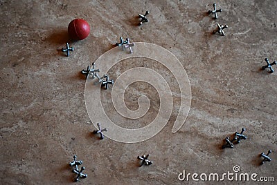 Retro game of jacks with red ball on marble floor Stock Photo