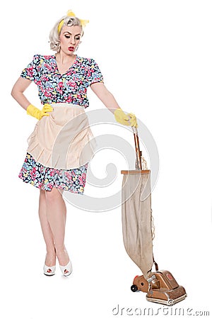 Retro housewife, with vintage vacuum cleaner, isolated on white Stock Photo