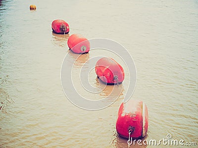 Retro look Life buoy in water Stock Photo