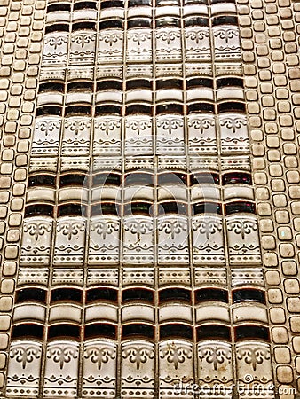 Tiling That Looks Like Library Books Stacked with Fleur De Lis Design Stock Photo