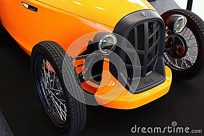 Retro looking front mask of compact microcar Patak Rodster, new manufacturer of microcars in Slovakia, in light orange colour Editorial Stock Photo