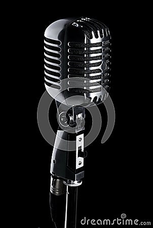 Retro microphone on stand on black Stock Photo