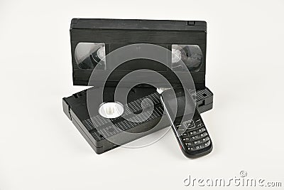 Retro objects on a white background. push-button telephone and video cassette. Analog media technology of the past. Copy space Stock Photo