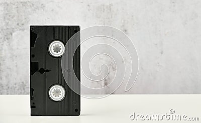 Retro objects on a white background. push-button telephone and video cassette. Analog media technology of the past. Copy space Stock Photo
