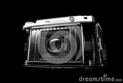 Retro photo camera close up on the black background Stock Photo