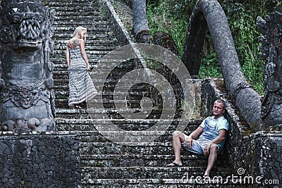 Retro photo of unusual couple at the mystical hotel Stock Photo