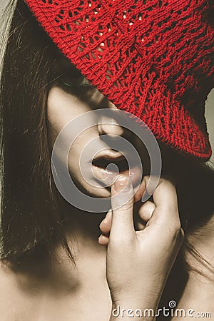 Retro portrait of seductive adult woman with red hat Stock Photo