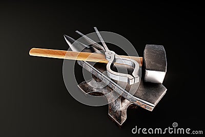 Retro profession concept, blacksmith, hard work, strength. Metal heavy anvil and hammer isolated on a dark background. 3D Cartoon Illustration