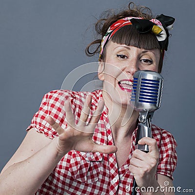 Retro singer in studio with 30s female performing artist Stock Photo