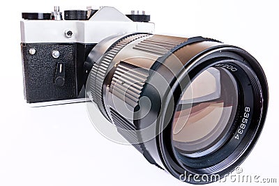 Retro SLR camera with telephoto lens Stock Photo