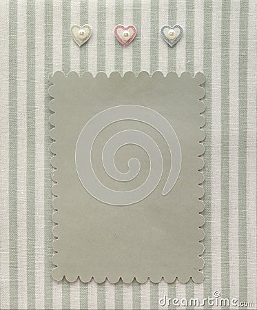 Retro style album page with blank photo and hearts decoration on vintage striped pattern textile Stock Photo