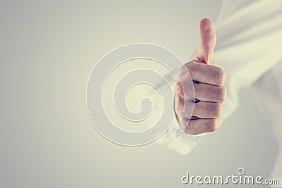 Retro style image of a man giving a thumbs up Stock Photo