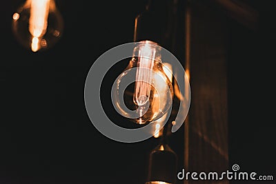 Retro style incandescent lamps. Light bulbs in the dark. selective focus Stock Photo