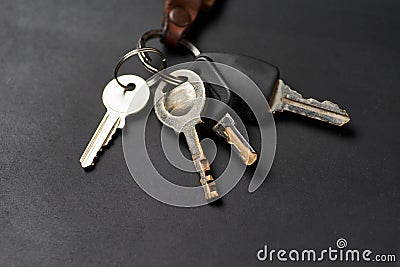 The bunch of keys on the black floor Stock Photo