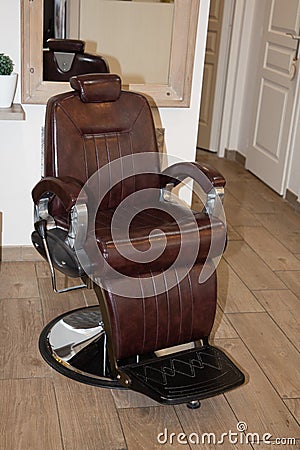 Retro styled brown seat barber armchair Editorial Stock Photo