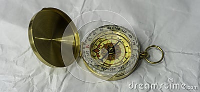 Retro styled golden compass Vintage still life. Sailing accessories. Travel, navigation, history, collecting, hobby Stock Photo