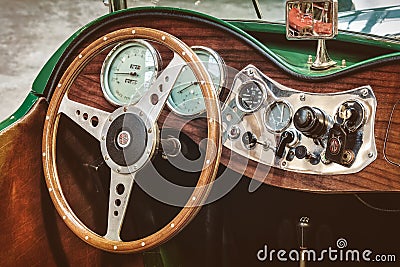 Retro styled image of the dashboard of a 1953 MG TD Roadster Editorial Stock Photo