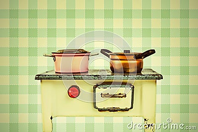 Retro styled image of a doll house cooking stove Stock Photo