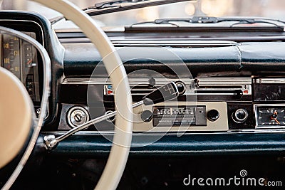 Retro styled image of an old car radio and dashboard inside a classic car Stock Photo