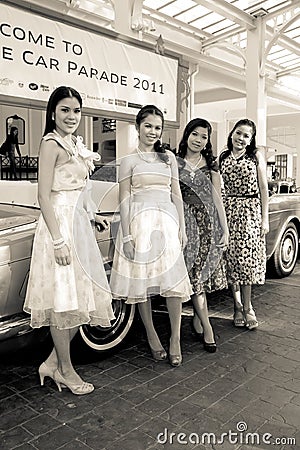 Retro styled models on Vintage Car Parade Editorial Stock Photo