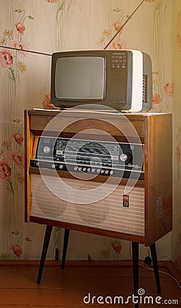 Retro technology, vintage radiogram 1960s and tube tv at home in living room, old school style 1970s Editorial Stock Photo