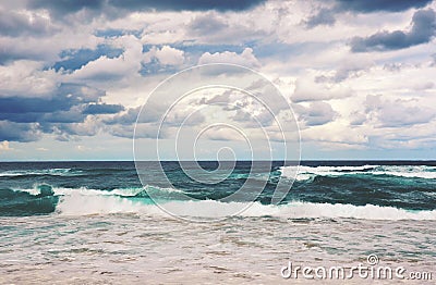 Retro toned dramatic stormy beach scene Stock Photo