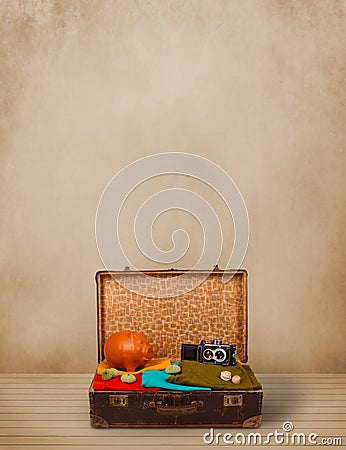 Retro tourist luggage with colorful clothes and copyspace Stock Photo