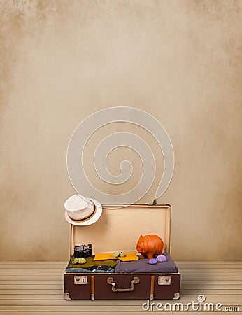 Retro tourist luggage with colorful clothes and copyspace Stock Photo