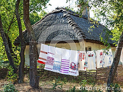 Retro ukrainian cottage. Traditional embroidered shirt and towel Stock Photo