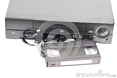 Retro video cassette recorder with VHS cassette with unwound tape on white background. Stock Photo