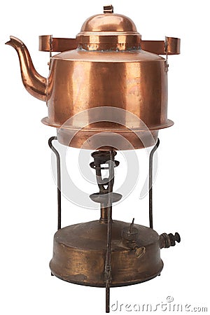 Retro vintage bronze primus stove with copper teapot Stock Photo