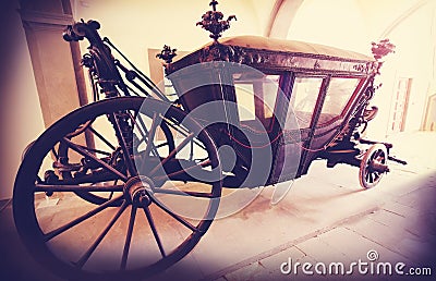 Retro vintage filtered picture of an old wooden carriage. Stock Photo