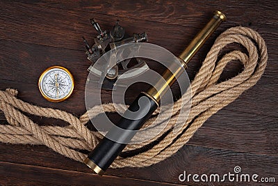 Retro vintage naval spyglass telescope with sextant and compass Stock Photo