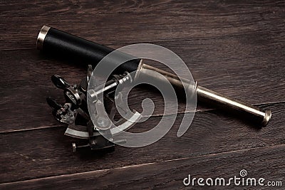 Retro vintage spyglass telescope with sextant Stock Photo