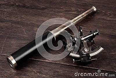 Retro vintage spyglass telescope with sextant Stock Photo