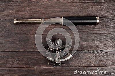 Retro vintage spyglass telescope with sextant Stock Photo