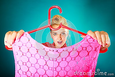 Retro vintage woman holding hanger with top Stock Photo