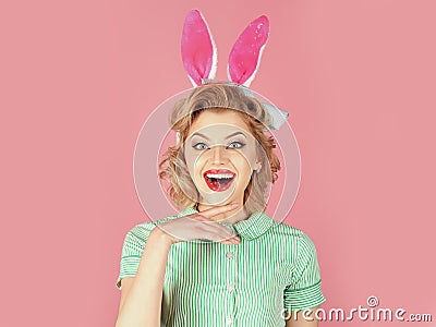 Retro woman in bunny ears, easter. Easter, makeup, pinup party, girl in rabbit ears. Vintage look. Sexy blond girl with Stock Photo