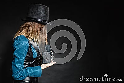 Retro woman with old camera. Steampunk. Stock Photo
