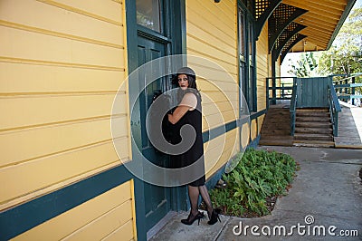 Retro Woman at Train Depot Stock Photo
