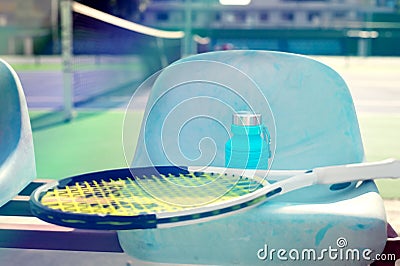 Reusable blue water bottle at tennis court Stock Photo